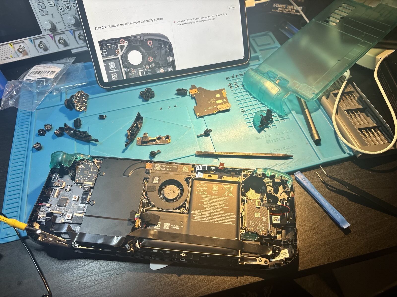 The Steam Deck with the back removed, and several components taken out of it.